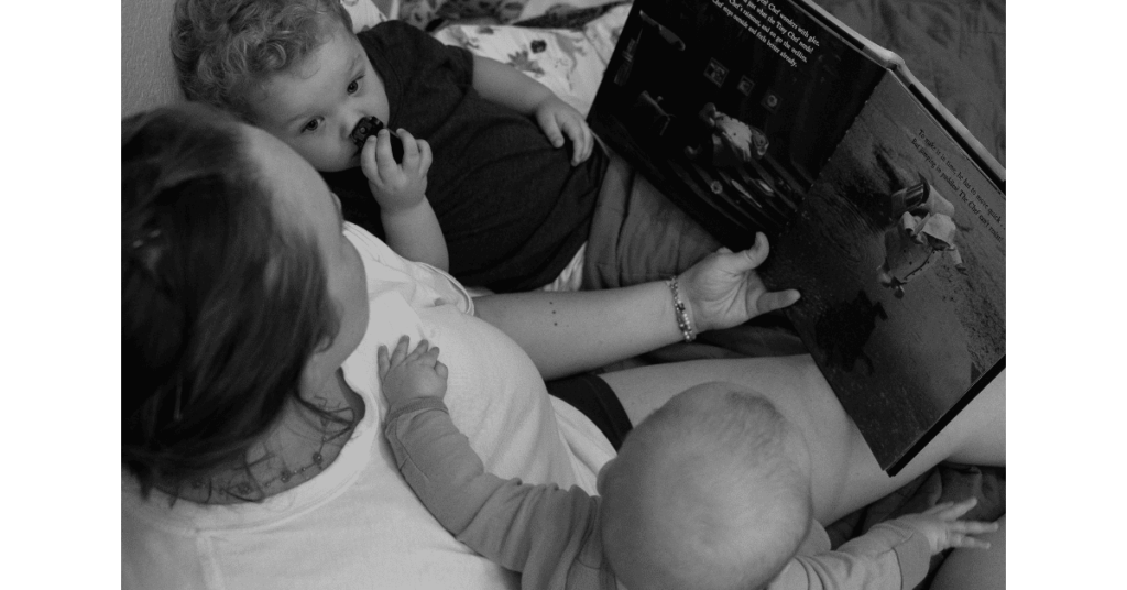 Mother reading to her kids in a quiet moment at home during a lifestyle family photography session in Fort Worth