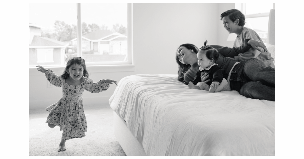 Mom, dad, and kids sharing authentic, everyday moments in their home during a Fort Worth documentary family photography session.